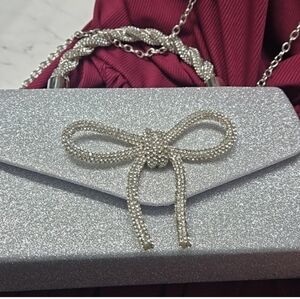 Elegant Sparkling Silver Handbag with Bow Accent